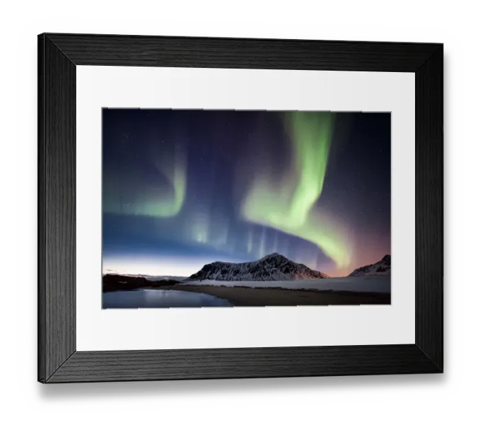 Framed Print : northern lights over a mountain on the beach