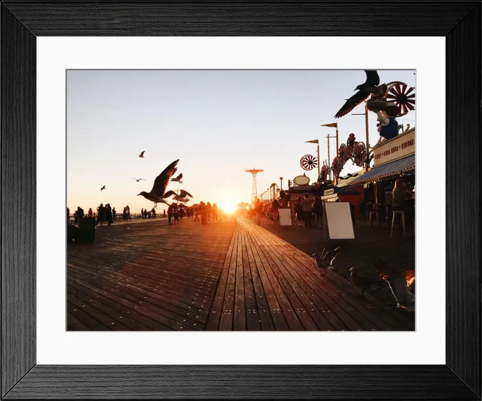 Framed Print : Idyllic sunset with flying birds at Coney Island, Brooklyn, New York City, USA Framed Print : Idyllic sunset with flying birds at Coney Island, Brooklyn, New York City, USA