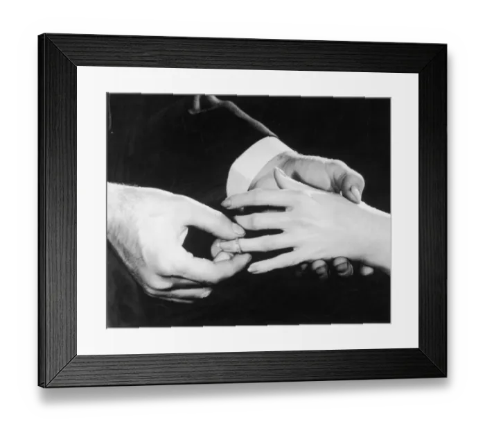 Framed Print : Marry Me. A man slips an engagement ring onto his fiancees finger, circa 1950 Framed Print : Marry Me. A man slips an engagement ring onto his fiancees finger, circa 1950