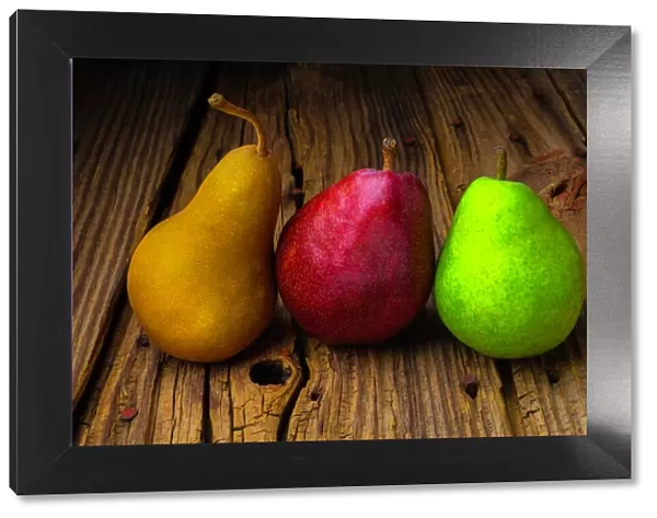 Three Pears on old wooden surface