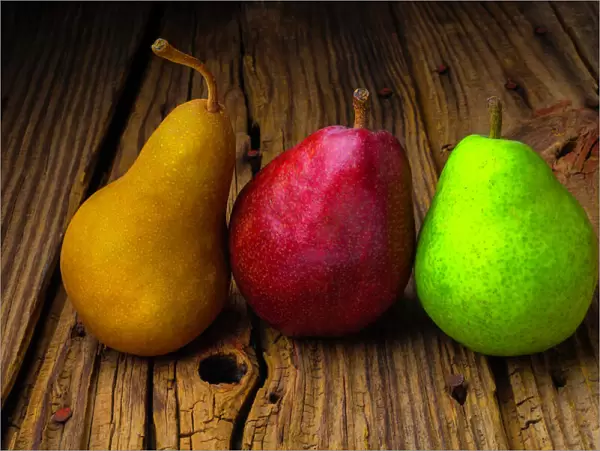 Three Pears on old wooden surface