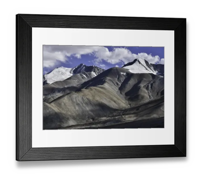 Framed Print : Amazing scenic view of high mountain road in rugged rock covered with melting snow against the background of dramatic blue sky, Leh district, Ladakh range, Himalayas, Jammu & Kashmir, Northern India Framed Print : Amazing scenic view of high mountain road in rugged rock covered with melting snow against the background of dramatic blue sky, Leh district, Ladakh range, Himalayas, Jammu & Kashmir, Northern India