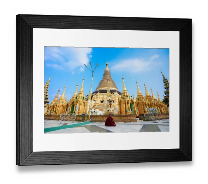 Framed Print : A monk meditate in front of the Shwedagon Pagoda