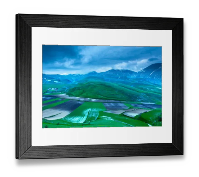 Framed Print : Plowed fields in the valley Monti Sibillini National Park, view from Castellucio di Norcia, Umbria, Italy Framed Print : Plowed fields in the valley Monti Sibillini National Park, view from Castellucio di Norcia, Umbria, Italy