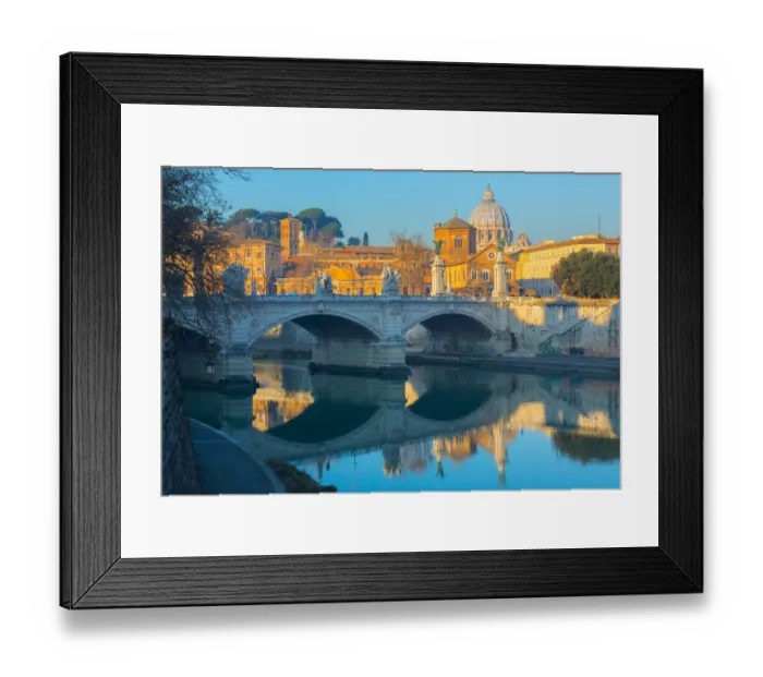 Framed Print : Ponte Vittorio Emmanual II over the Tiber river in Rome, in the background the dome of St. Peter Basilica Framed Print : Ponte Vittorio Emmanual II over the Tiber river in Rome, in the background the dome of St. Peter Basilica
