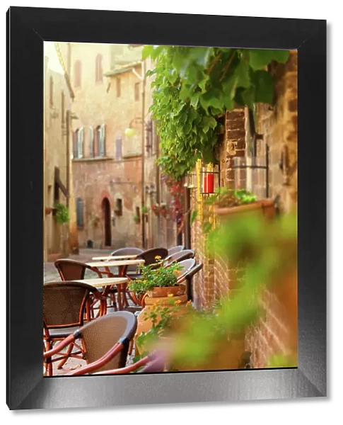 Restaurant tables in an old italian town in Tuscany, Italy