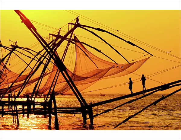Traditional chinese fishing nets in Kochi, India at sunrise
