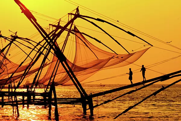 Traditional chinese fishing nets in Kochi, India at sunrise