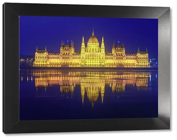 The Parliament of Hungary with the Danube river (Budapest, Hungary) in the night