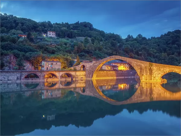 The Ponte della Maddalena in Tuscany at dusk