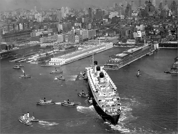 Ocean liner with tug boats in NY harbor