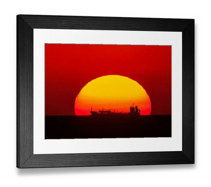 Framed Print : Boat in the setting sun