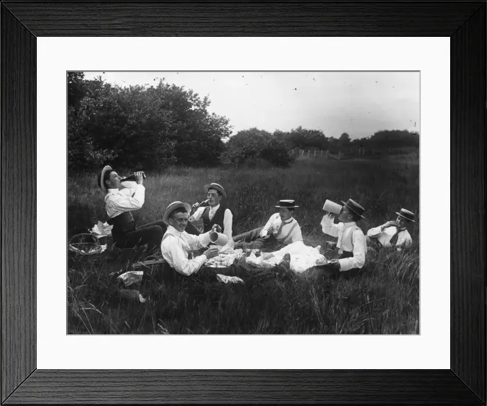 Framed Print : Men Only. A group of shirtsleeved men enjoying a picnic in a field Framed Print : Men Only. A group of shirtsleeved men enjoying a picnic in a field