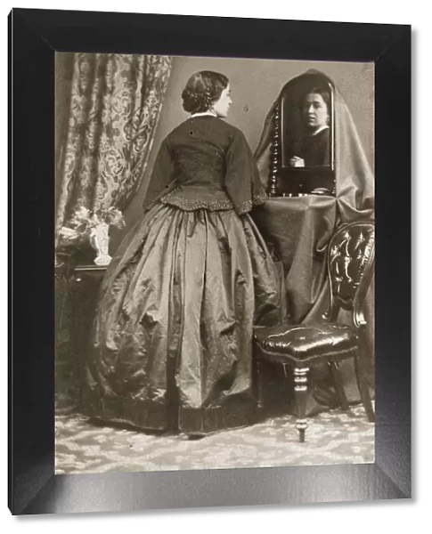 Not Bad. circa 1855: A woman in a short fitted jacket with a basque worn