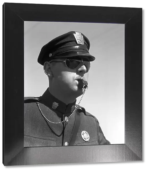 Highway Patrolman In Uniform And Sunglasses Blowing His Whistle Without Use Of His Hands Badge Cap Chain Keystone