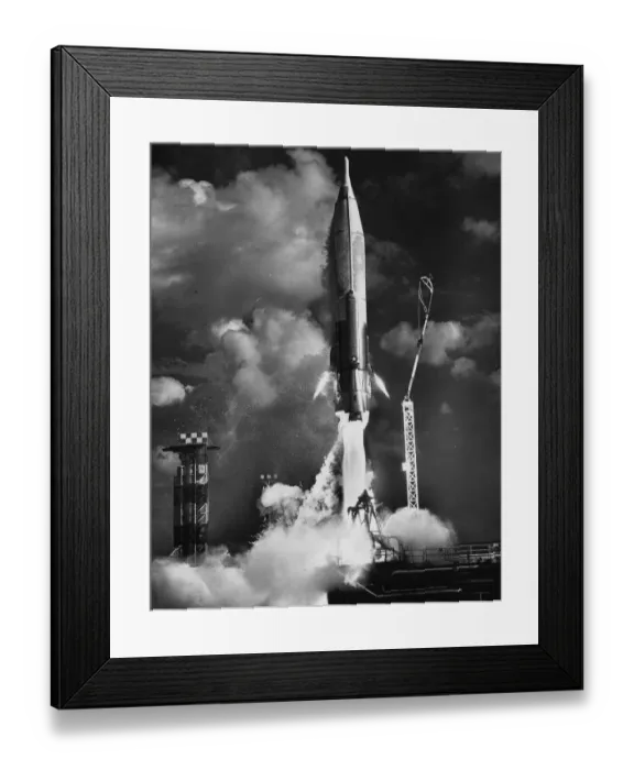 Framed Print : Rocket. A rocket leaving its launch pad