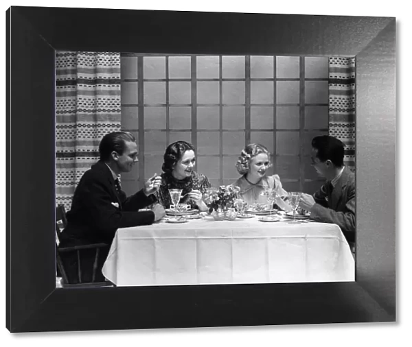 Two couples dining in club restaurant