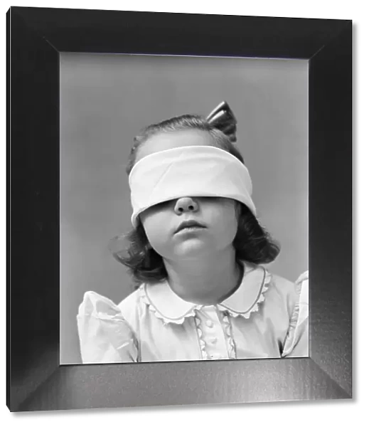 Girl wearing blindfold, playing game