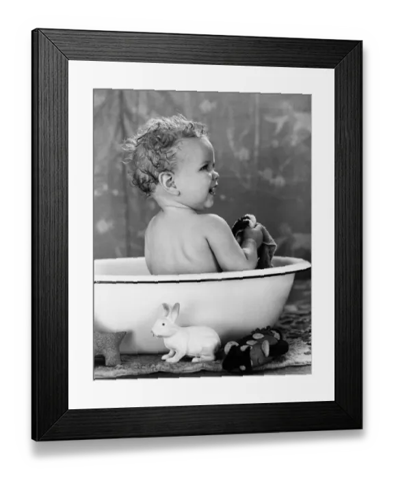 Framed Print : Baby with wet hair sitting in wash basin, smiling, taking a bath Framed Print : Baby with wet hair sitting in wash basin, smiling, taking a bath