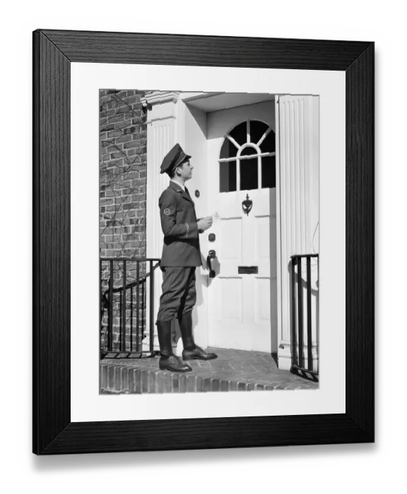 Framed Print : Teenage messenger boy delivering message at front door Framed Print : Teenage messenger boy delivering message at front door