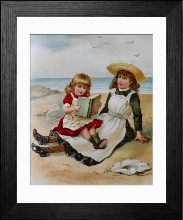 Framed Print : Two girls sitting on beach reading a book Framed Print : Two girls sitting on beach reading a book