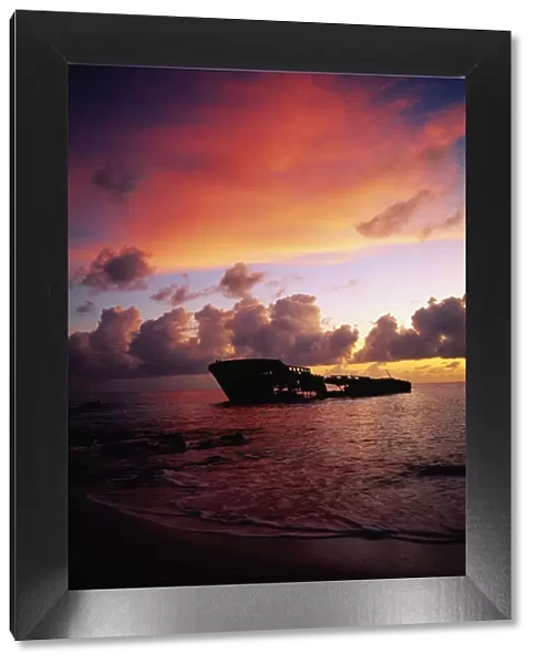 West Indies, Grand Cayman, Seven Mile Beach, ship wreck at sunset