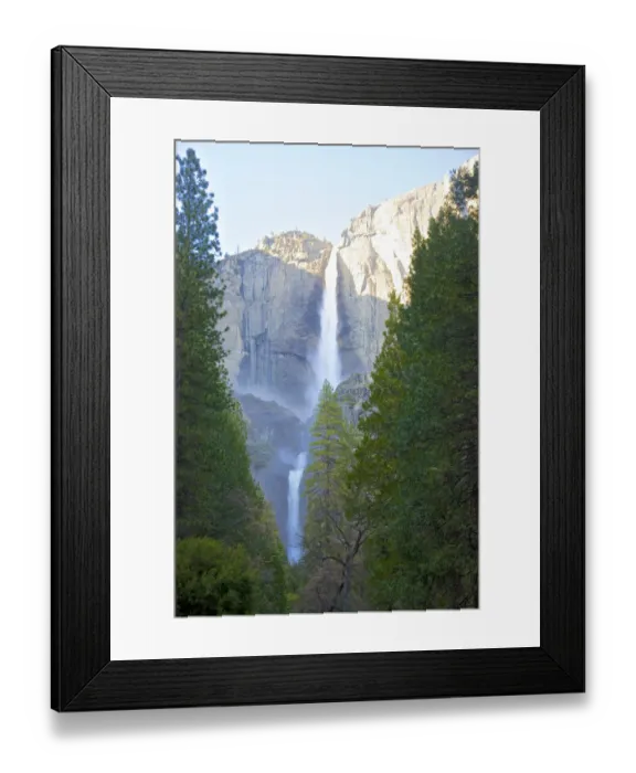 Framed Print : Majestic waterfall with tall trees, cliff and blue sky Framed Print : Majestic waterfall with tall trees, cliff and blue sky
