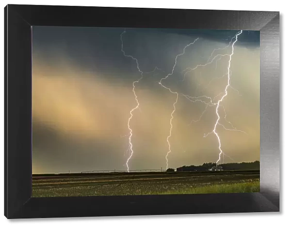 Multiple Lightning strikes hit a ranch in Nebraska at sunset, USA