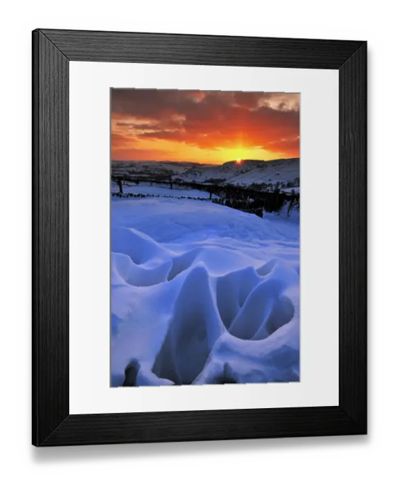 Framed Print : Strange natural snow formations at sunset with the Derbyshire countryside. UK