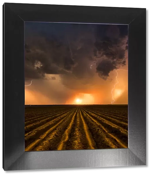 Sunset Thunderstorm over a ploughed field, Nebraska. USA
