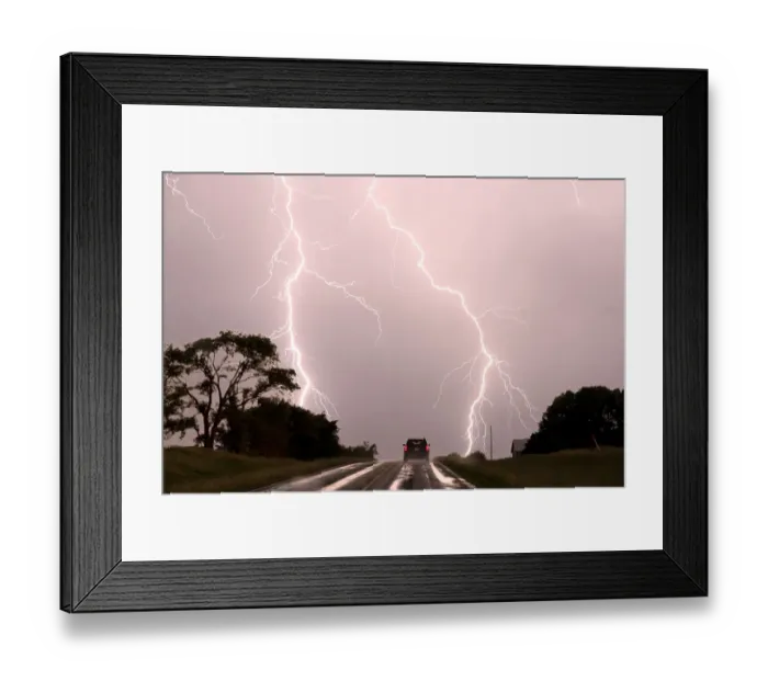Framed Print : Driving into the storm, Double lightning bolts over highway. Nebraska. USA Framed Print : Driving into the storm, Double lightning bolts over highway. Nebraska. USA