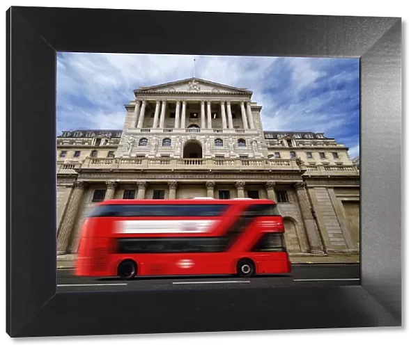 Bank of England with a passing red London double-decker bus, London, England, United Kingdom