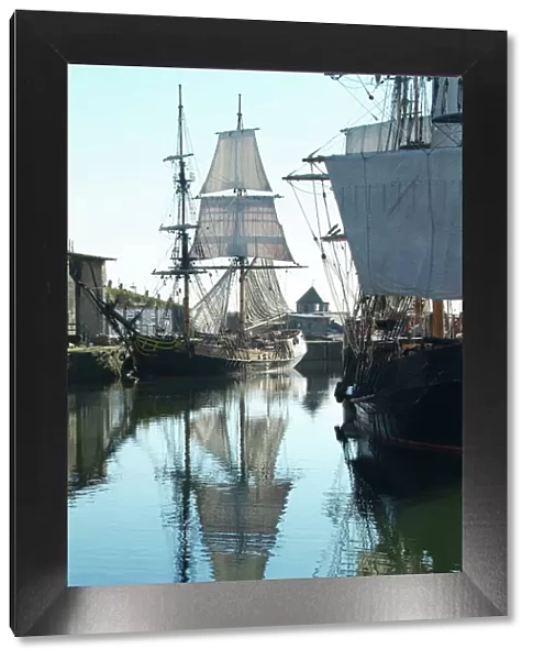 Tall sailing ships in Charlestown harbor England