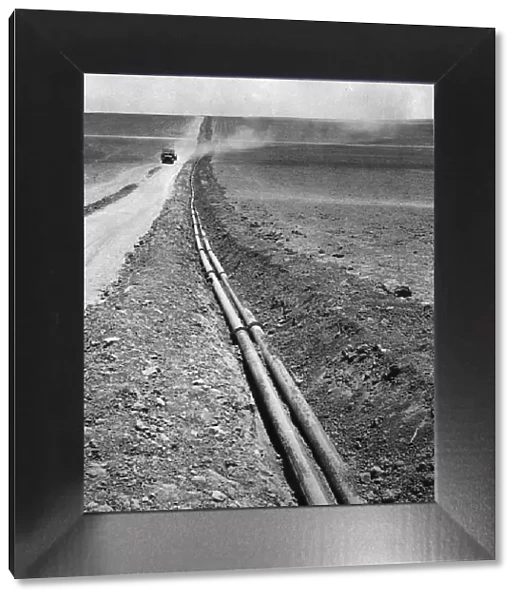 Pipeline. circa 1950: Miles of pipeline running through the countrysided in Israel