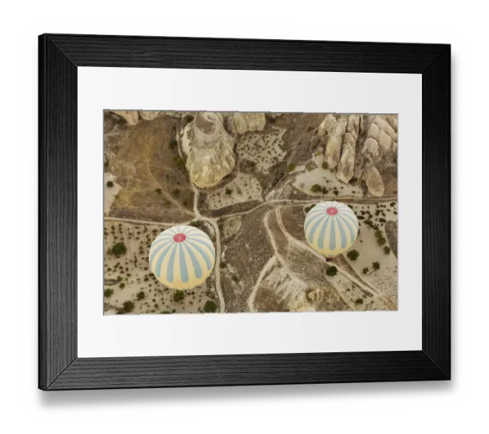 Framed Print : Colorful hot air balloons flying over Red valley at Cappadocia, Anatolia, Turkey. Volcanic mountains in Goreme national park Framed Print : Colorful hot air balloons flying over Red valley at Cappadocia, Anatolia, Turkey. Volcanic mountains in Goreme national park
