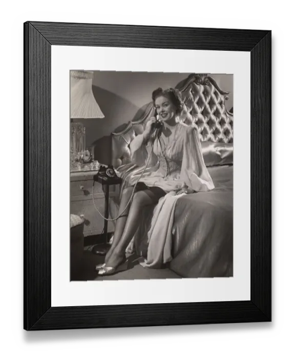 Framed Print : Woman in lingerie on phone in bedroom