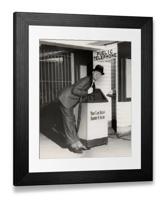 Framed Print : Executive with arm in public trash receptacle