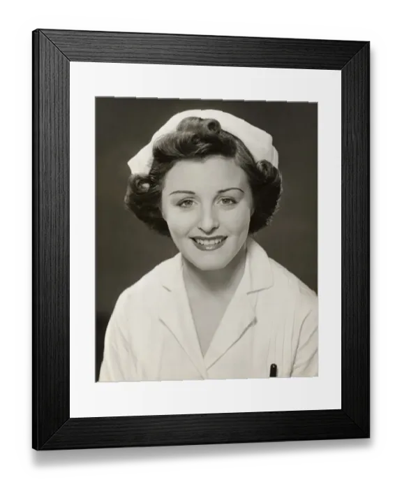 Framed Print : Close-up of smiling nurse Framed Print : Close-up of smiling nurse