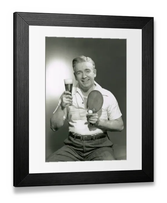 Framed Print : Man holding drink and paddle Framed Print : Man holding drink and paddle