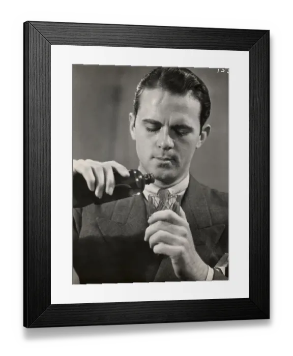 Framed Print : Man pouring medicine into glass Framed Print : Man pouring medicine into glass