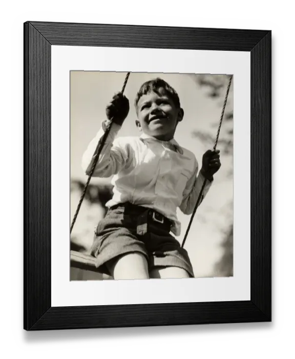 Framed Print : Boy in swing outdoors Framed Print : Boy in swing outdoors