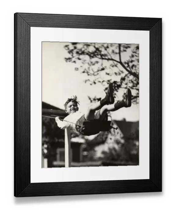 Framed Print : Small boy on swing outdoors Framed Print : Small boy on swing outdoors