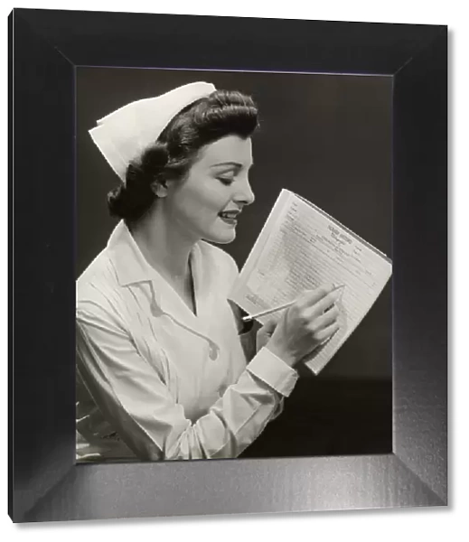 Nurse w patients medical chart