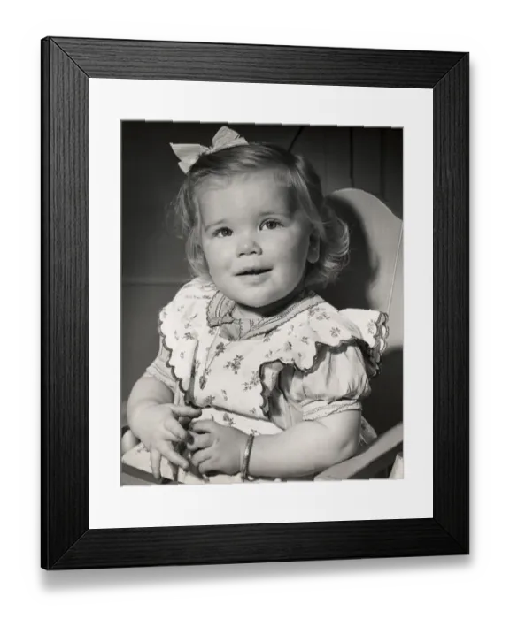 Framed Print : Toddler sitting in her highchair Framed Print : Toddler sitting in her highchair