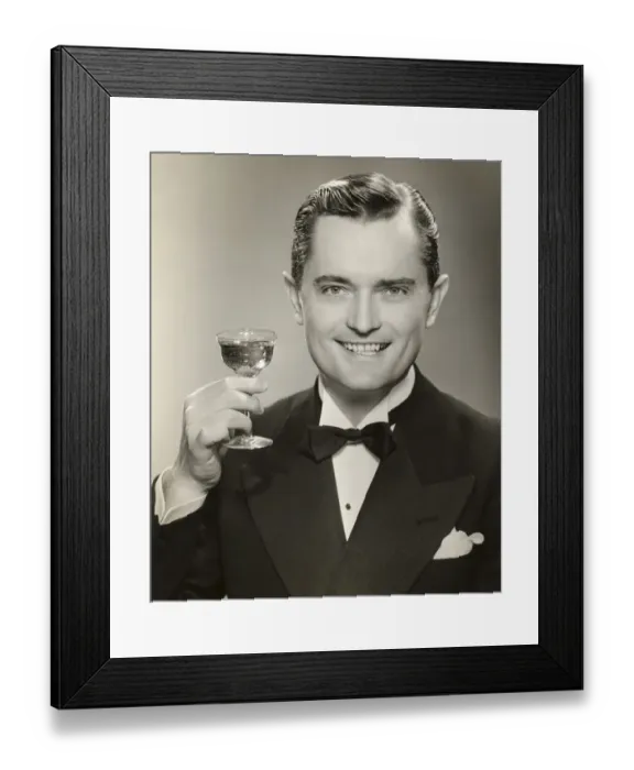 Framed Print : Man in evening clothes raising glass Framed Print : Man in evening clothes raising glass