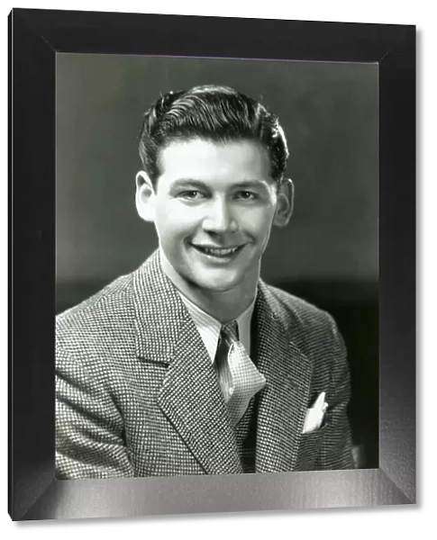 Smiling young man in business suit