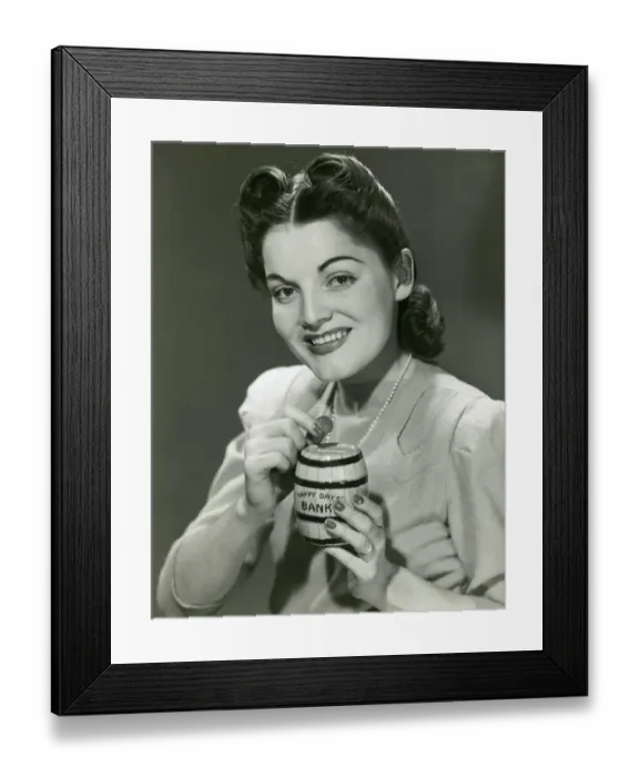 Framed Print : Woman saves pennies in toy bank Framed Print : Woman saves pennies in toy bank