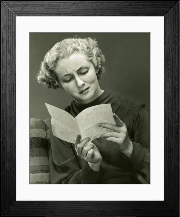 Framed Print : Woman reads distressing letter Framed Print : Woman reads distressing letter