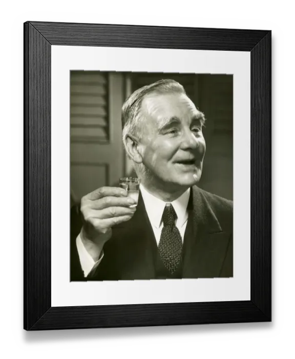 Framed Print : Man holding drink up Framed Print : Man holding drink up