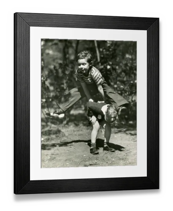 Framed Print : Young boys playing leap frog Framed Print : Young boys playing leap frog